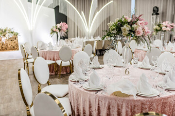 Bright festive hall with beautiful flowers and serving