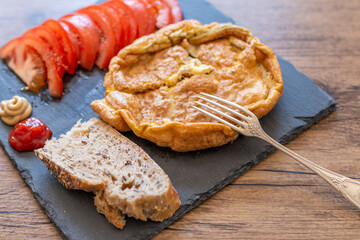 breakfast with eggs, tomatoes and bread