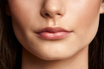 Beauty makeup. Woman face. Macro close-up nude lips 