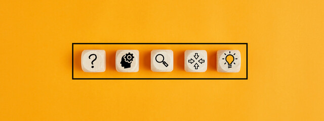Process of idea formation or creation and problem solving. Thinking, analyzing, research, information gathering and idea icons on wooden cubes.