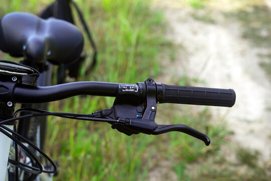 Half a bicycle wheel. The handle close up.
