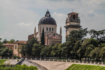 Fototapeta na wymiar View of catholic church (Parrocchia di San Giorgio in Braida) on the riverbank of Adige river in Verona.