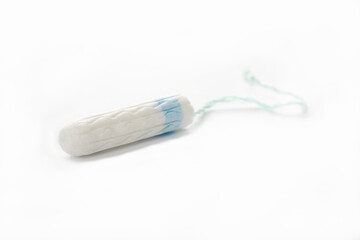 Protective white cotton tampon on a white background. Menstrual cycle.