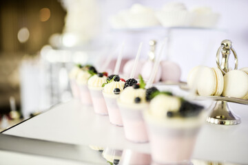 Beautiful desserts with candy bar with berries