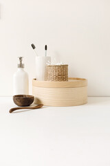 Beauty, health care morning routine products. Spa, wellness, treatment essentials. Toothbrushes, ear sticks, liquid soap cream on white table