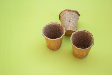 peat pots for seedlings isolated green background