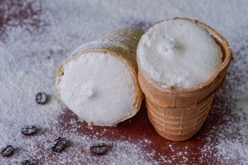 White creamy ice cream. Ice cream in a waffle cup. Close-up