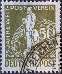 GERMANY, Berlin - CIRCA 1949: a postage stamp from Germany, Berlin in olive green color showing the Postmaster Heinrich von Stephan Text: 75 years of world post association