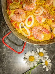 paella in a pan and flower