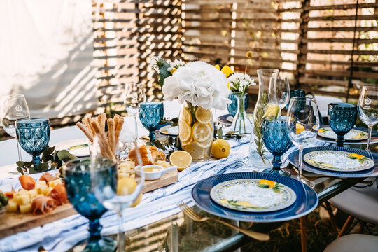 Decorated table in a rustic style, outdoors at a party.