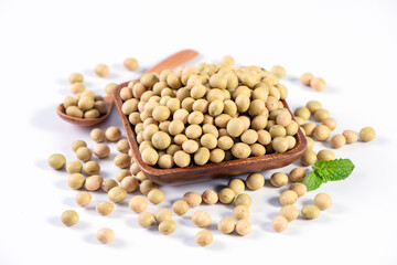 Yellow-green Taiwanese organic non-GMO soybeans, soy beans in a container isolated on white backgorund, close up, clipping path.