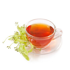 Linden tea in a transparent cup with linden buds and leaves isolated on a white background.
