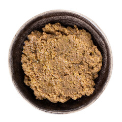 Tapenade - olive paste made from green olives. Spreadable green olive cream in bowl isolated on white.