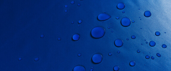 drops of water on a fabric surface. macro.