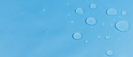 drops of water on the surface of the fabric. macro.