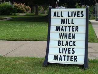 A sign outside a church in the summer of 2020 says All Lives Will Matter When Black Lives Matter in...