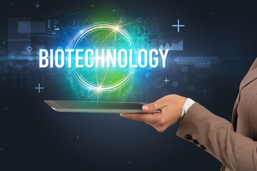 Close-up of a touchscreen with BIOTECHNOLOGY inscription, new technology concept