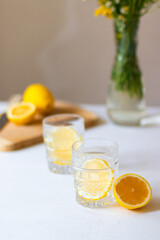 Top view of cold refreshing lemonade in glass on white background for summer party. Summer drinks with ice