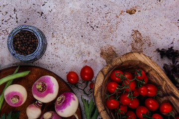 A variety of red tomatoes along with other fruits with a colorful look in the dish.