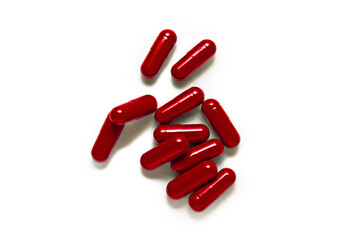 Red Pills capsule on white background