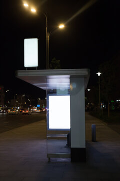 Bus stop in the city center at night