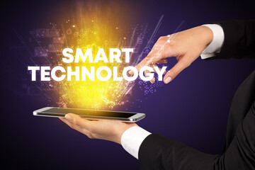 Close-up of a touchscreen with SMART TECHNOLOGY inscription, innovative technology concept