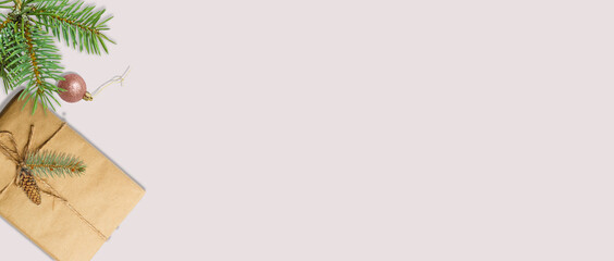 Christmas composition. Christmas gift, pine cones, thuja branches and gypsophila flowers. Flat lay, top view, copy space