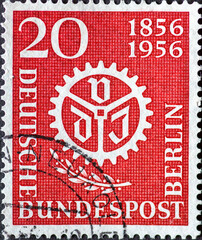 GERMANY, Berlin - CIRCA 1956: a postage stamp from Germany, Berlin showing VDI logo and a laurel branch. 100 years Association of German Engineers (VDI). brown