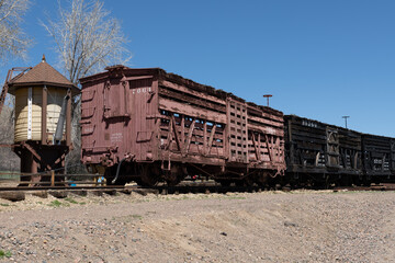 Late 1800's railroad rolling stock including a cattle car and a boxcar