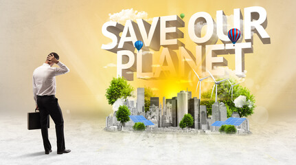 Rear view of a businessman standing in front of SAVE OUR PLANET inscription, Environmental protection concept