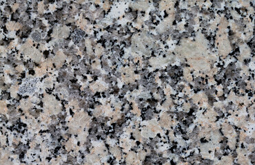 Multicolor patchy decorative granite background.