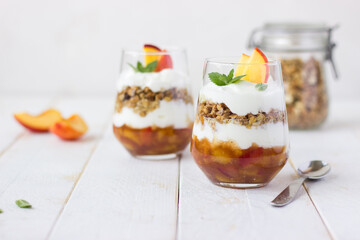 Delicious dessert with fruit yogurt and granola.  Summer, celebration, healthy, proper nutrition, female, dietary concept