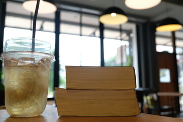 Iced beverage and book in cafe