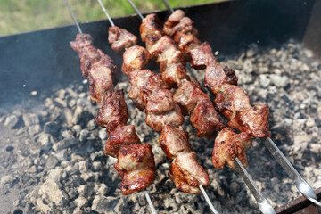 Frying pork neck on skewers