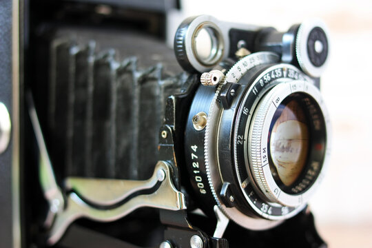 The lens of an old film camera