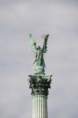 Fototapeta premium Heroes' Square or the Millennium Monument is the most important attraction of the city. Archangel Gabriel at the top of the Corinthian column. Tourist attraction Budapest, Hungary.