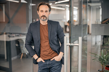 Businessman holding hand in his pocket in the modern office