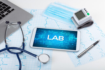 Close-up view of a tablet pc with LAB abbreviation, medical concept
