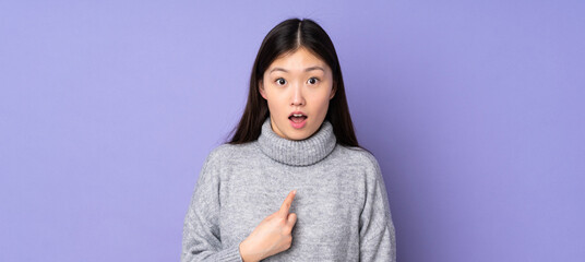 Young asian woman over isolated background pointing to oneself - obrazy, fototapety, plakaty