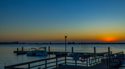 Fototapeta na wymiar Sunrise seen from the boat dock in the delta