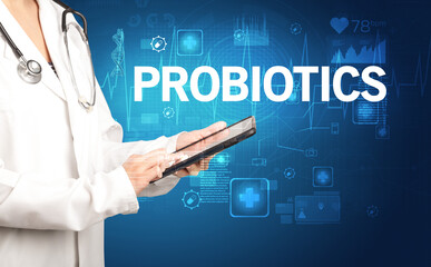 young doctor writing down notes with PROBIOTICS inscription, healthcare concept