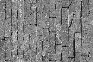 background with brick wall of stones. Cracks and scratches