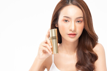 Beauty asian woman hold bottle cosmetic cream lotion  and cheerful.