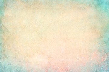 old colored and crumpled watercolor stained paper with pastel colors, background or texture