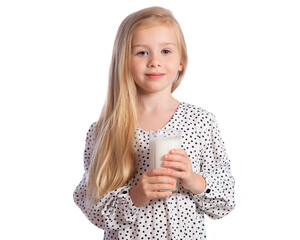 Beautiful European blonde girl with a glass of milk in her hands. A child on a white background for advertising milk. The child drinks milk.