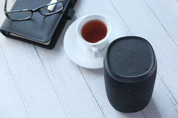 smart speaker and notepad with copy space on white background 