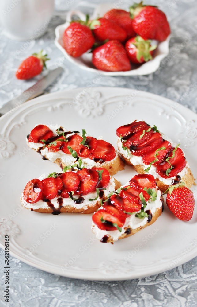 Wall mural Sandwich with strawberries. With soft cheese and balsamic vinegar. Soft focus.