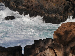 waves crashing on rocks