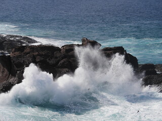 waves crashing on rocks