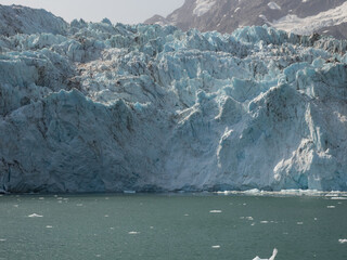 Surprise Glacier and ices floating in the sea . Prince William Sound, Alaska, USA.